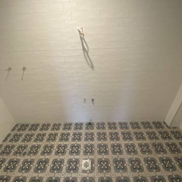 Gaffneys work in progress: patterned floor tiles laid before fixtures are installed