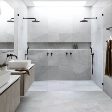 A completed Gaffneys walk-in twin shower with matte black fittings